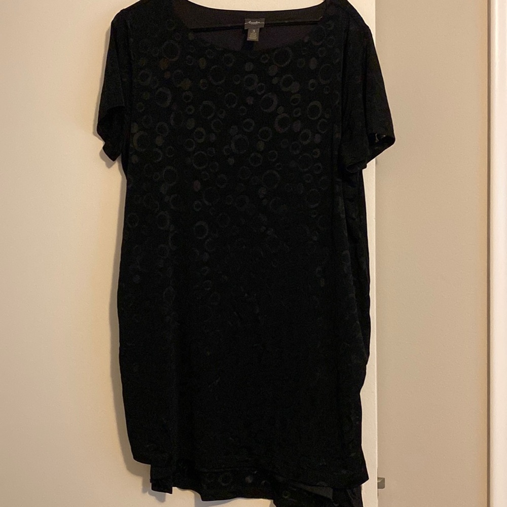 This is a Chico’s black top in a size 3!